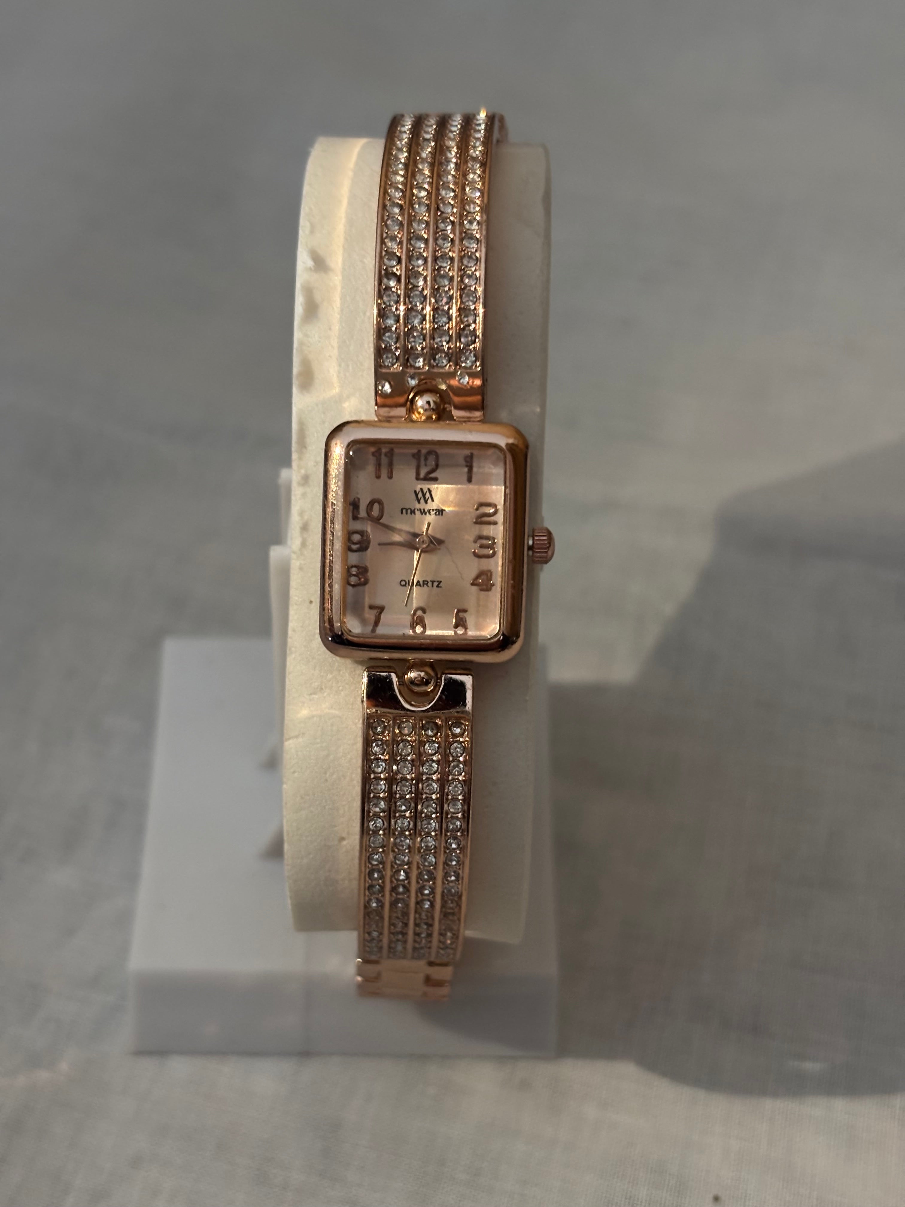 Golden chain with white dial