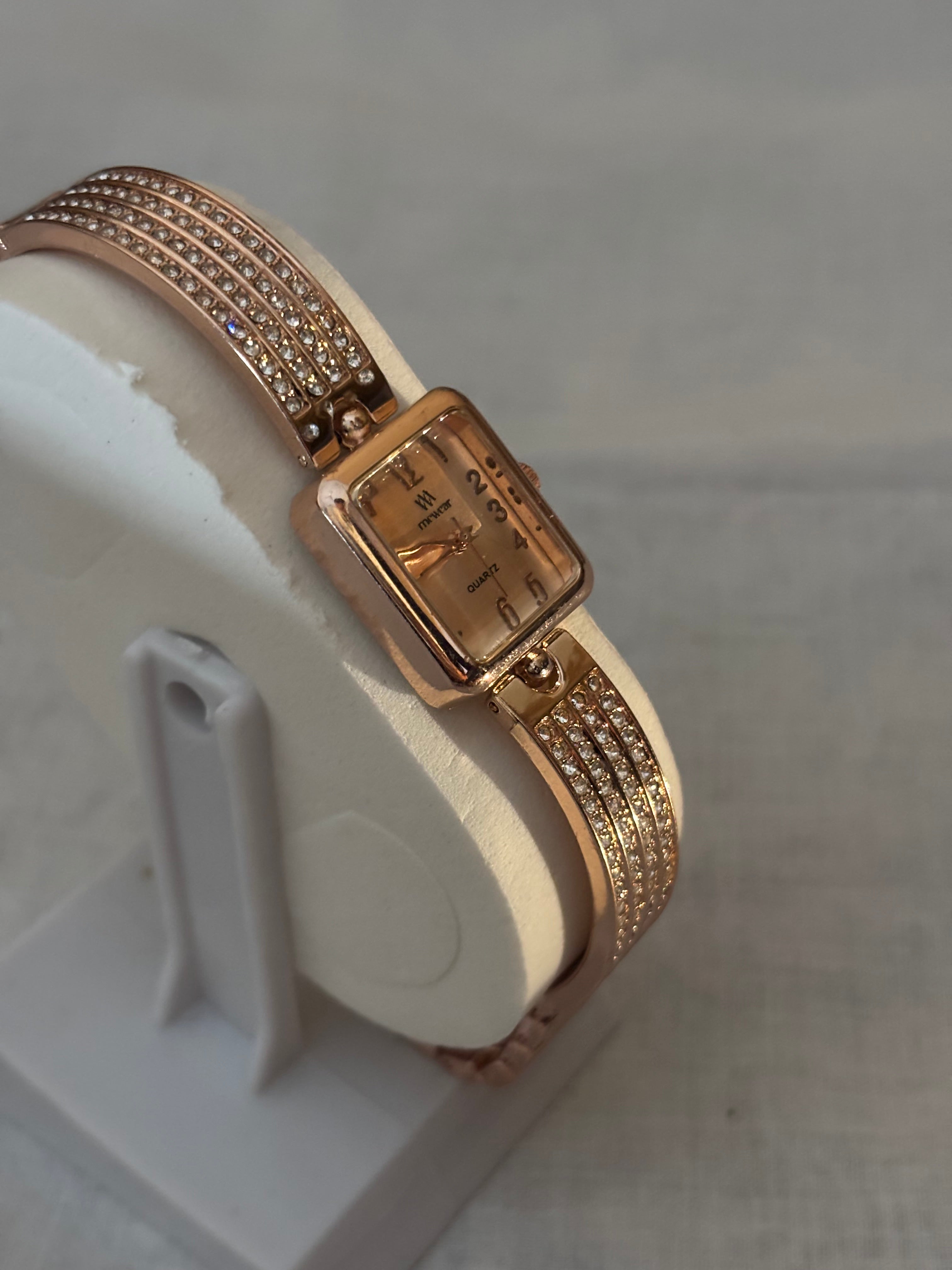 Golden chain with white dial