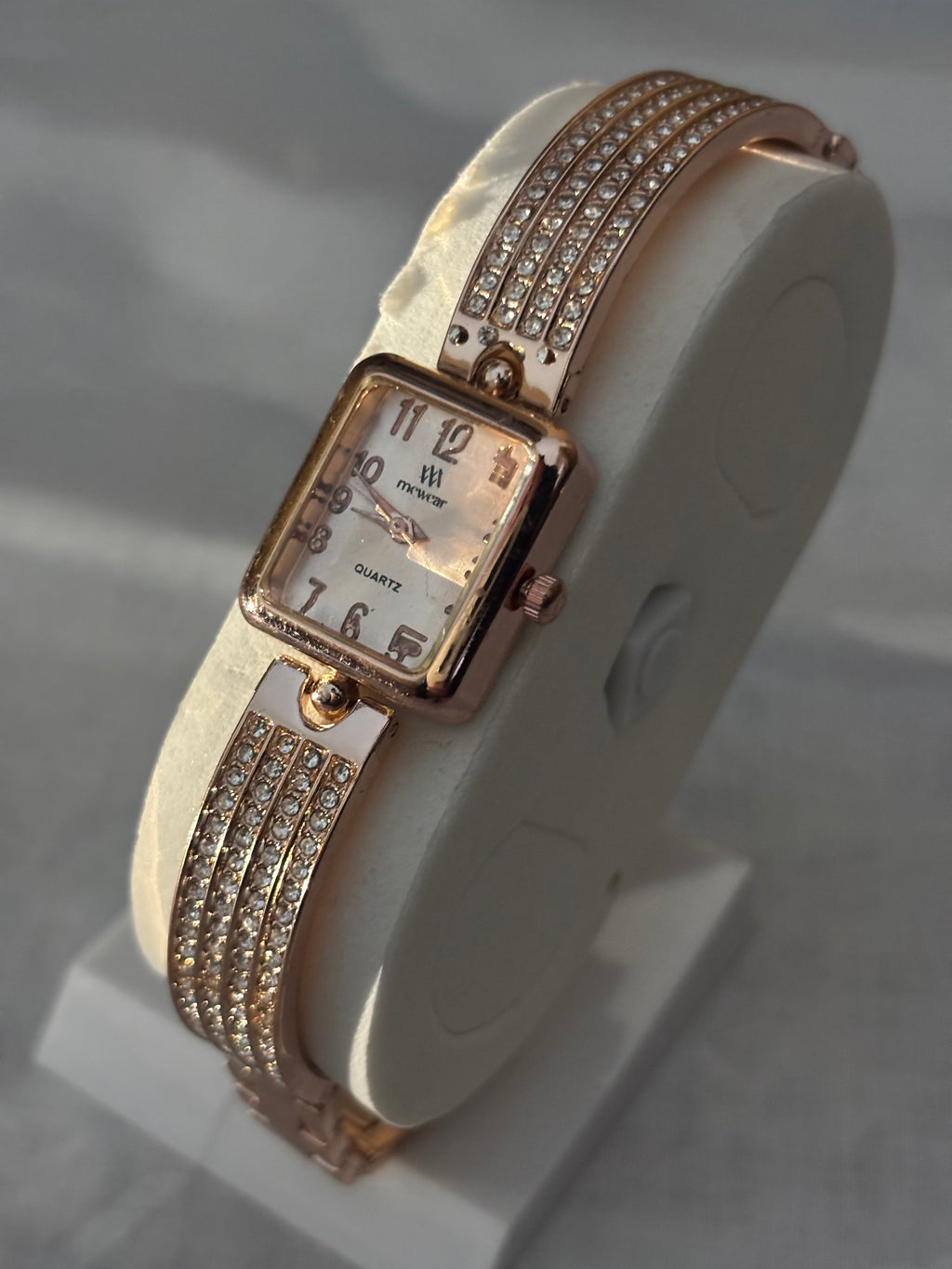 Golden chain with white dial